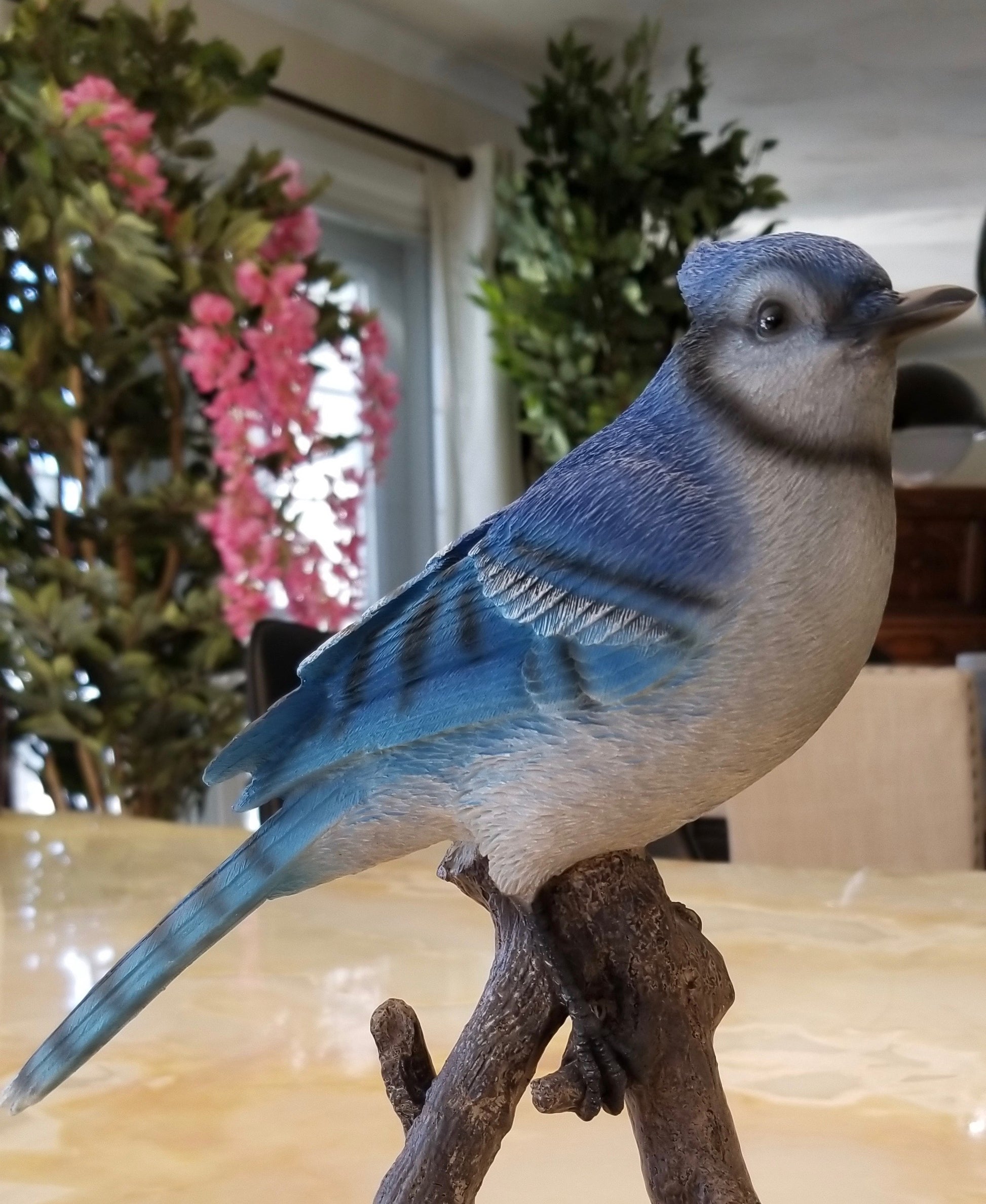 blue jay on a branch statue