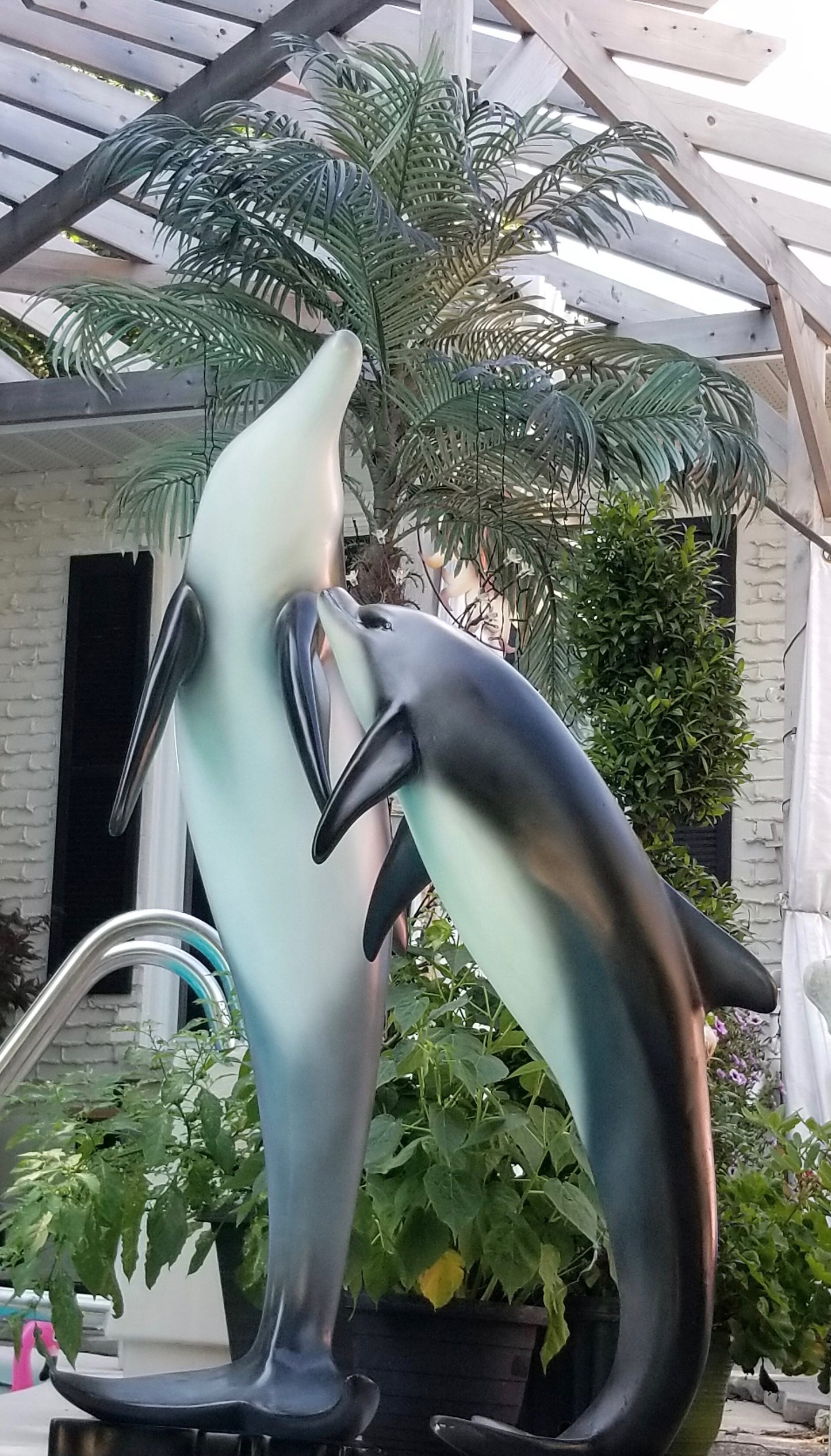 dolphin statue pair tropical pose