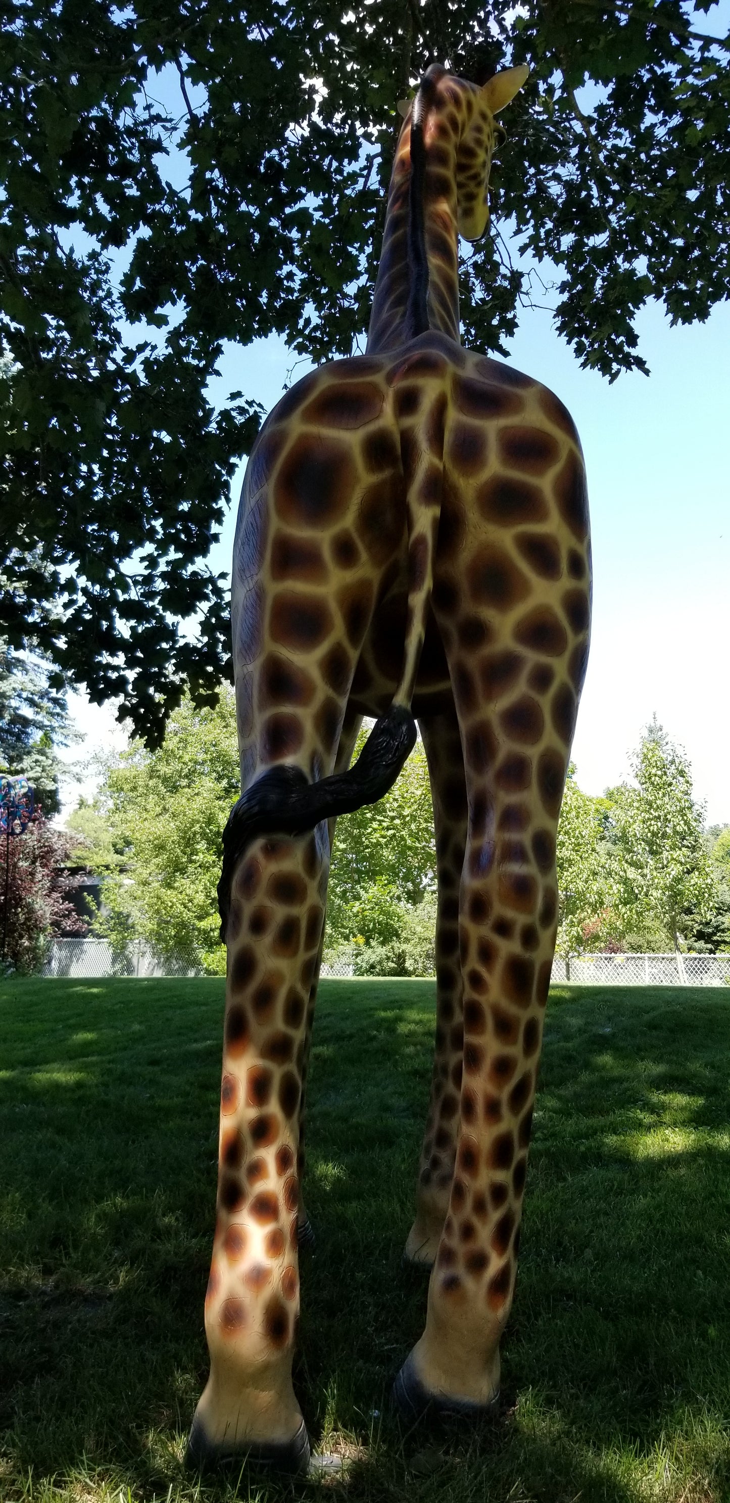 giraffe statue in tail pose