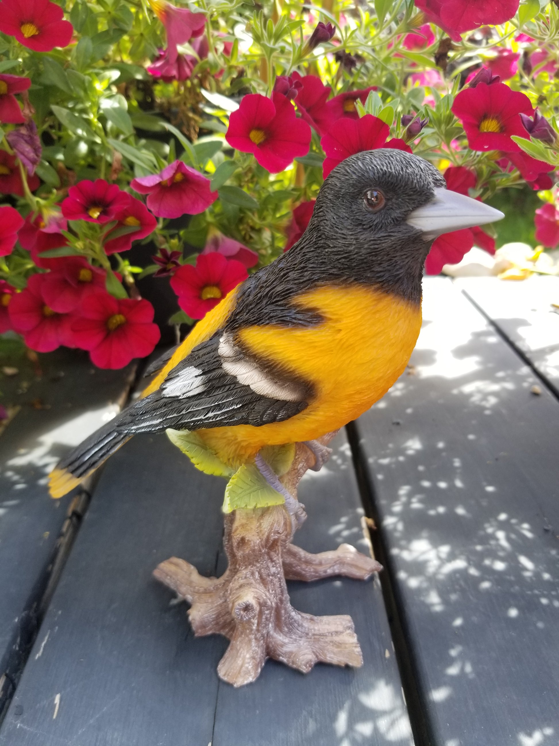 oriole on a branch statue