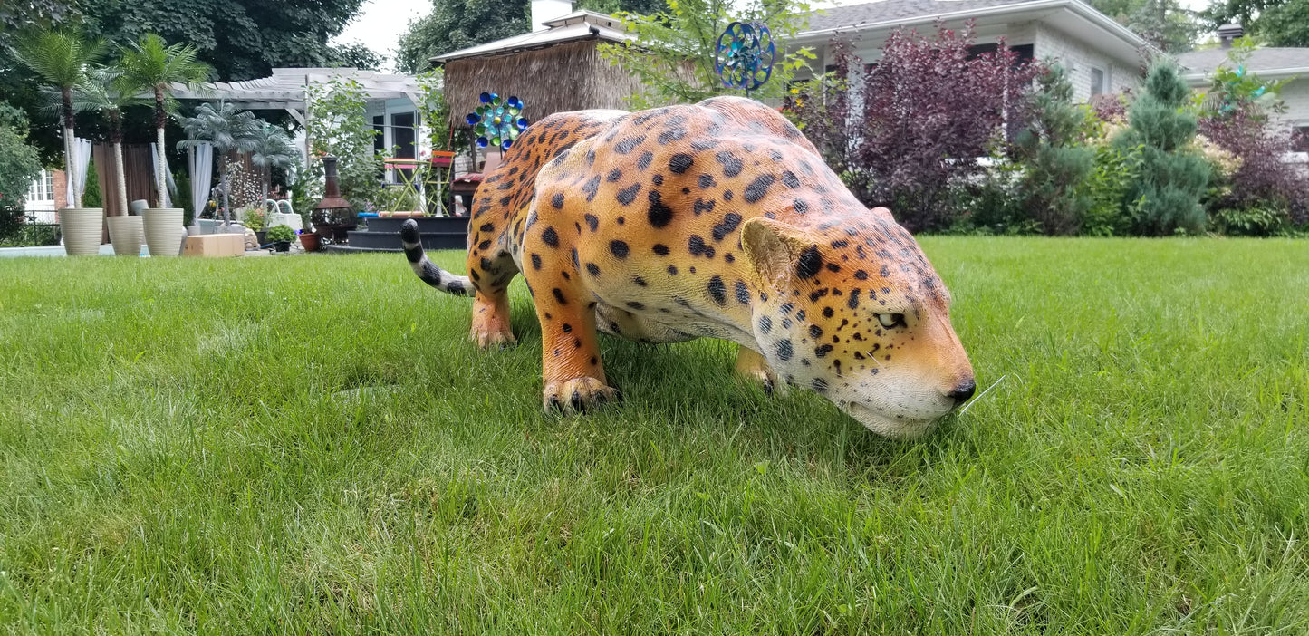 jaguar statue outside on the grass