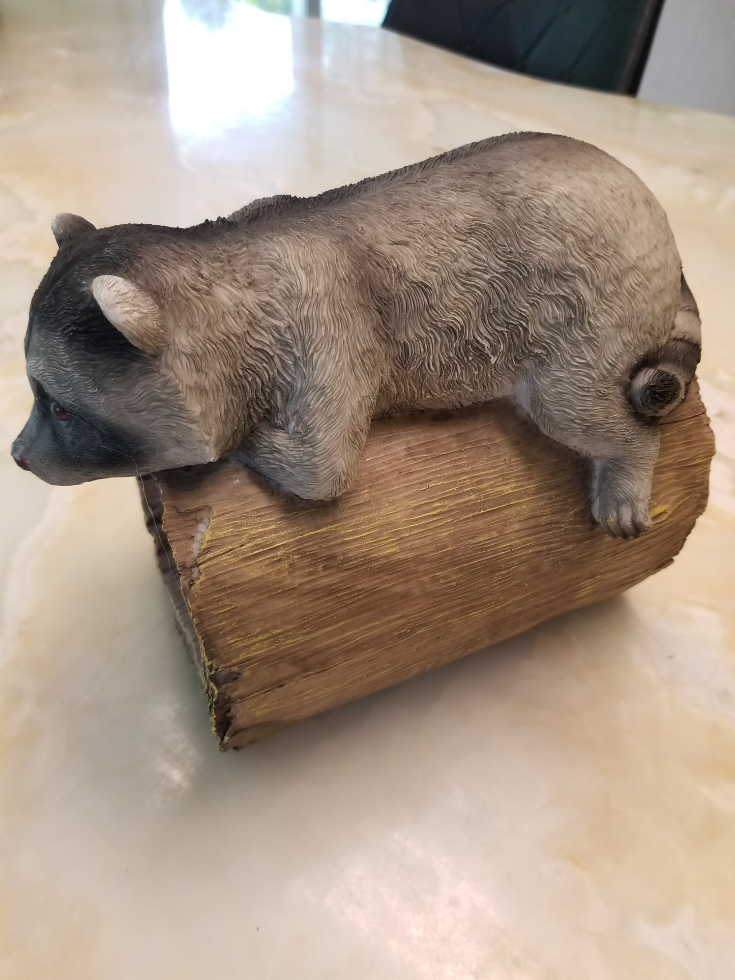 raccoon downspout statue side pose