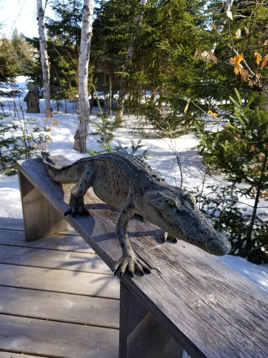 walking crocodile statue outdoors